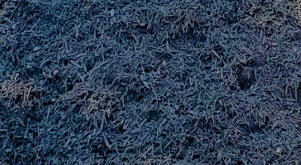 Close-up of Premium Black Mulch showing rich color and texture for landscaping, gardens, and flower beds from Mulch and Stuff