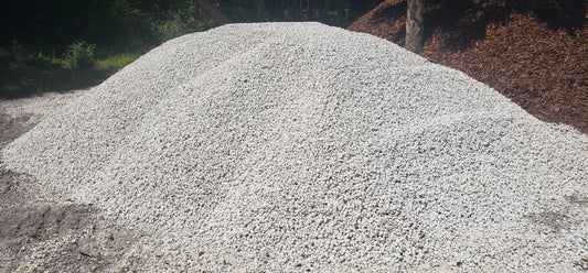 Large pile of #57 limestone aggregate showing bulk material size and texture