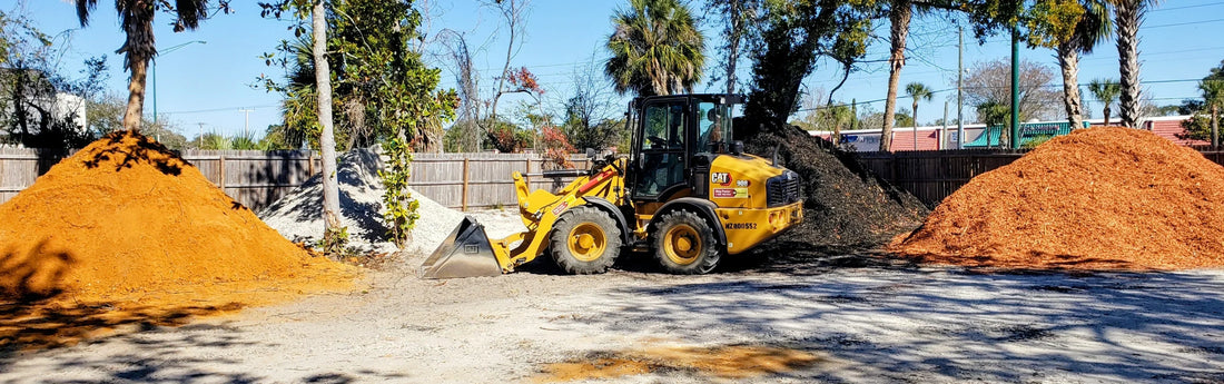 Dump truck delivering bulk landscape material