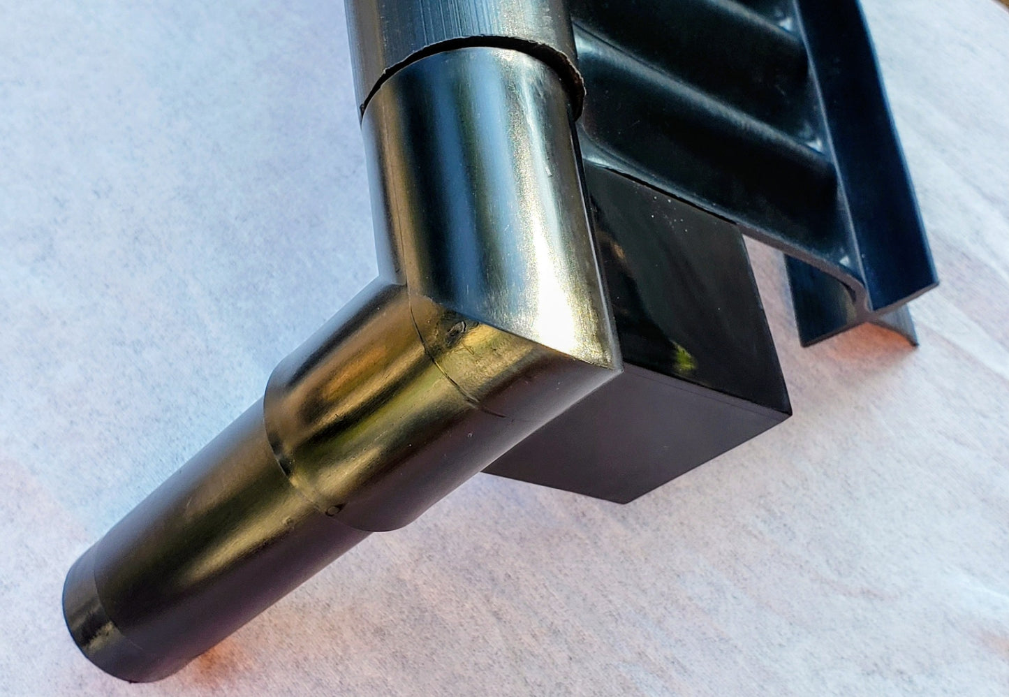 Alpha Edge 90° Corner Connector attached to 20-foot landscape edging strip for creating clean, professional right-angle garden and border layouts