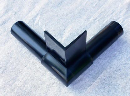 Top view of Alpha Edge 90° Corner Connector attached to 20-foot landscape edging strip showing seamless right-angle connection for professional borders