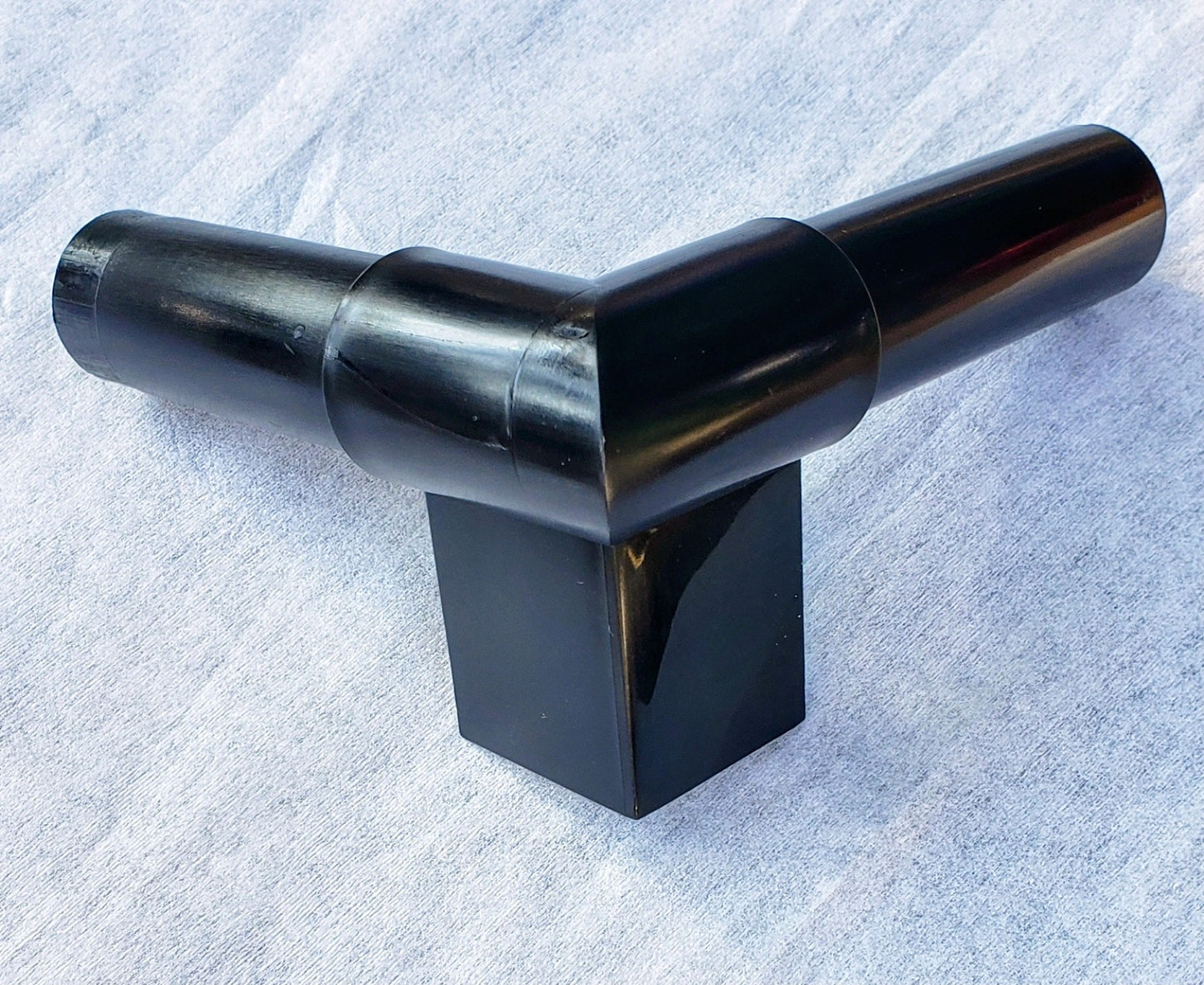 Side view of Alpha Edge 90° Corner Connector showing exterior profile and design for clean, professional landscape edging corners