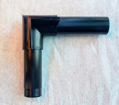 Top view of Alpha Edge 90° Corner Connector for landscape edging showing shape and design for professional right-angle installation