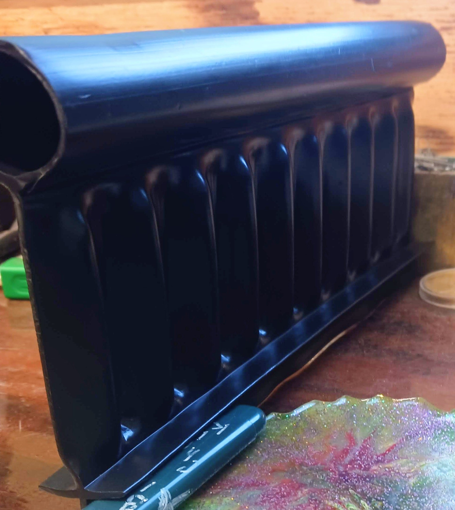 Side view profile of Alpha Edge heavy-duty landscape edging showing rigid design and thickness.