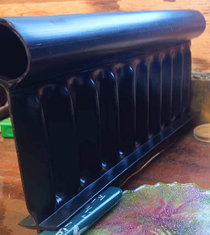 Side view profile of Alpha Edge heavy-duty landscape edging showing rigid design and thickness.