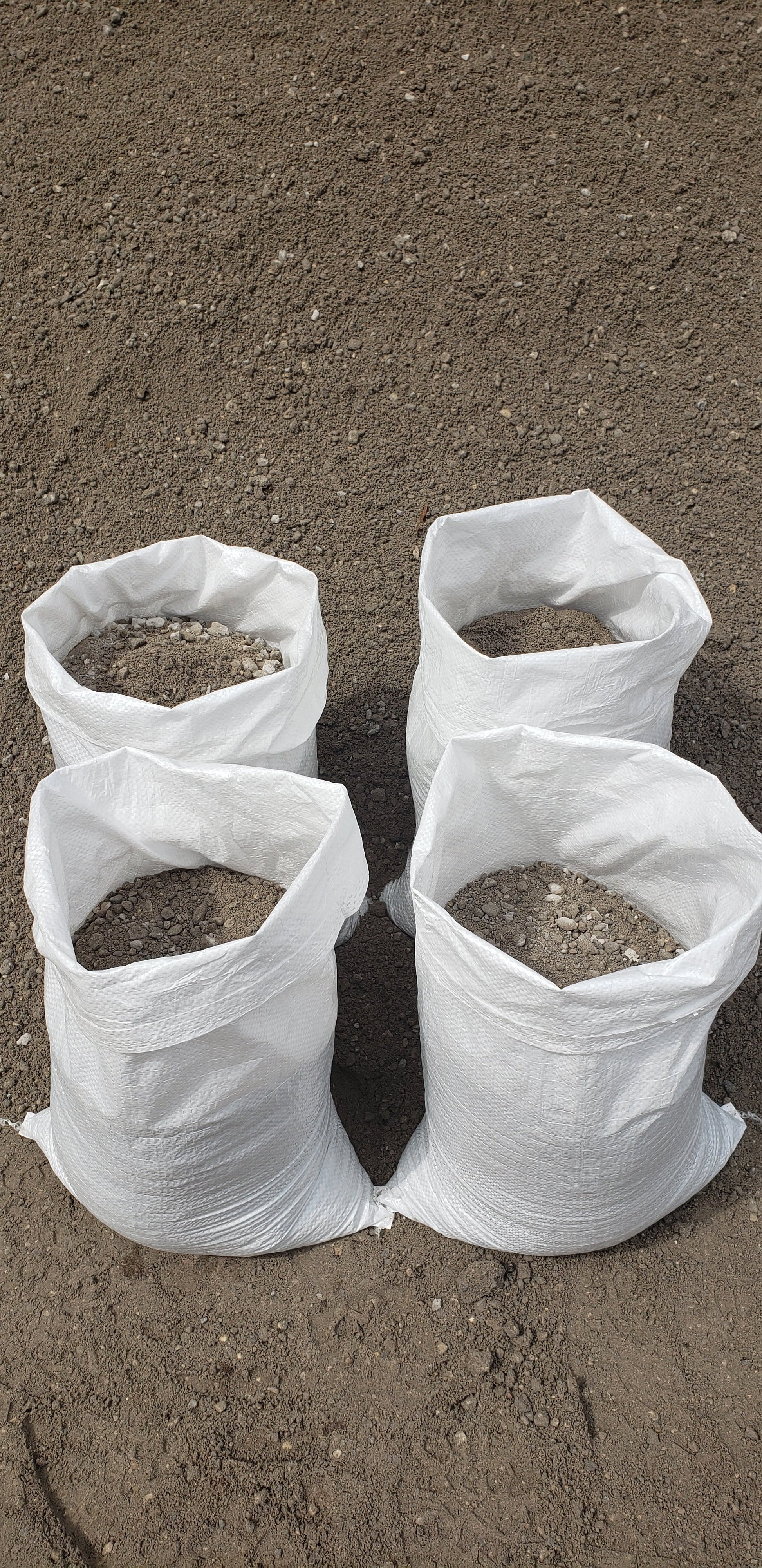 Bag of Premium Paver Base Type 1 Grade A, finely refined recycled concrete ideal for small paver projects, leveling, and walkways from Mulch and Stuff