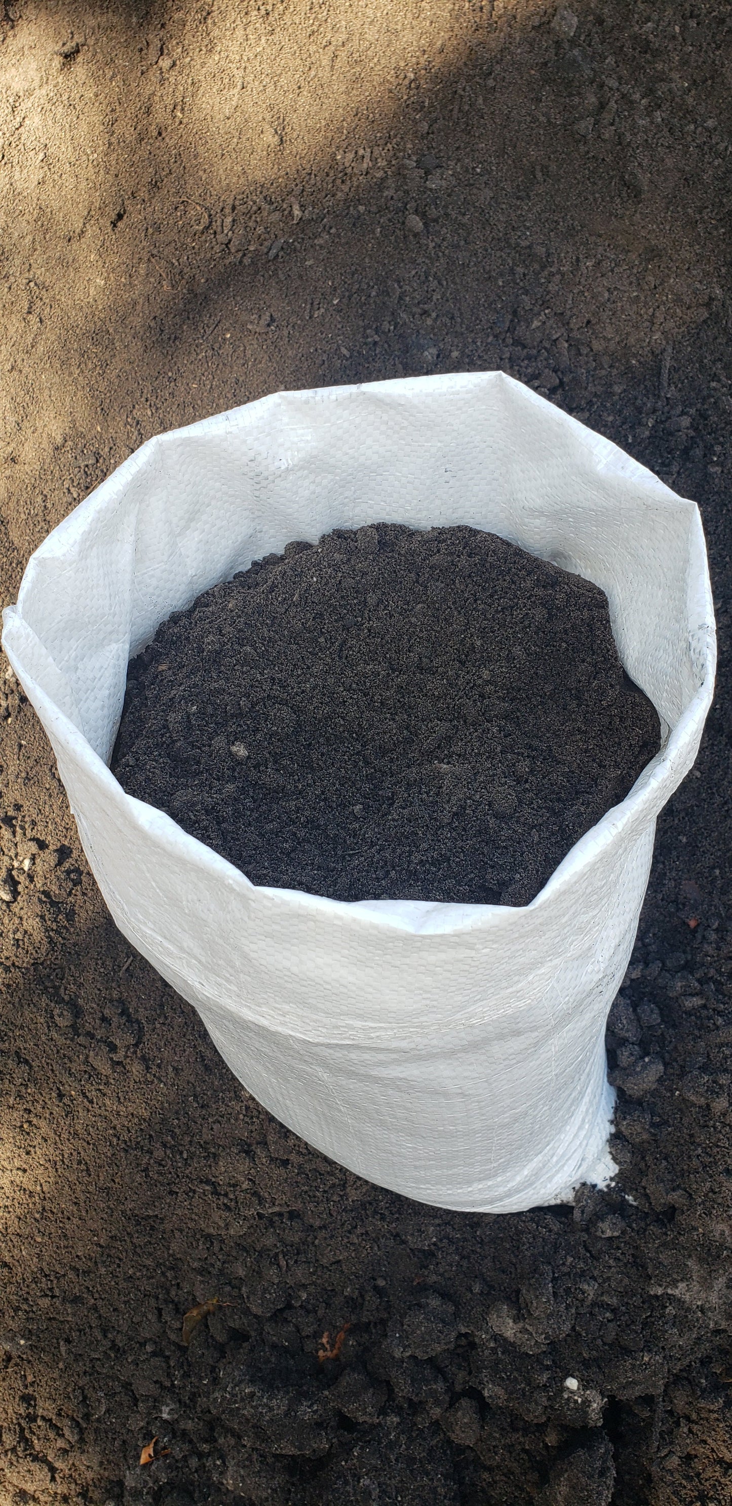 Bag of premium top soil, clean and nutrient-rich, ideal for small landscaping projects, gardens, and lawns, Mulch and Stuff, Ormond Beach, FL