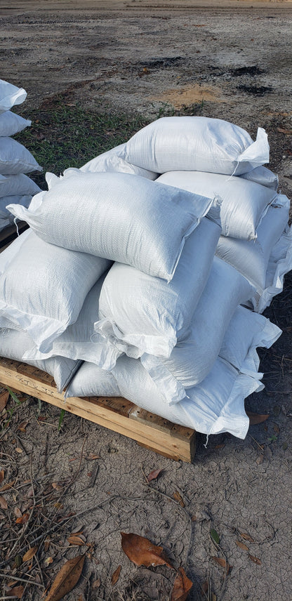 Bag of premium white coarse sand, clean and consistent texture, ideal for masonry, construction, and small landscaping projects from Mulch and Stuff