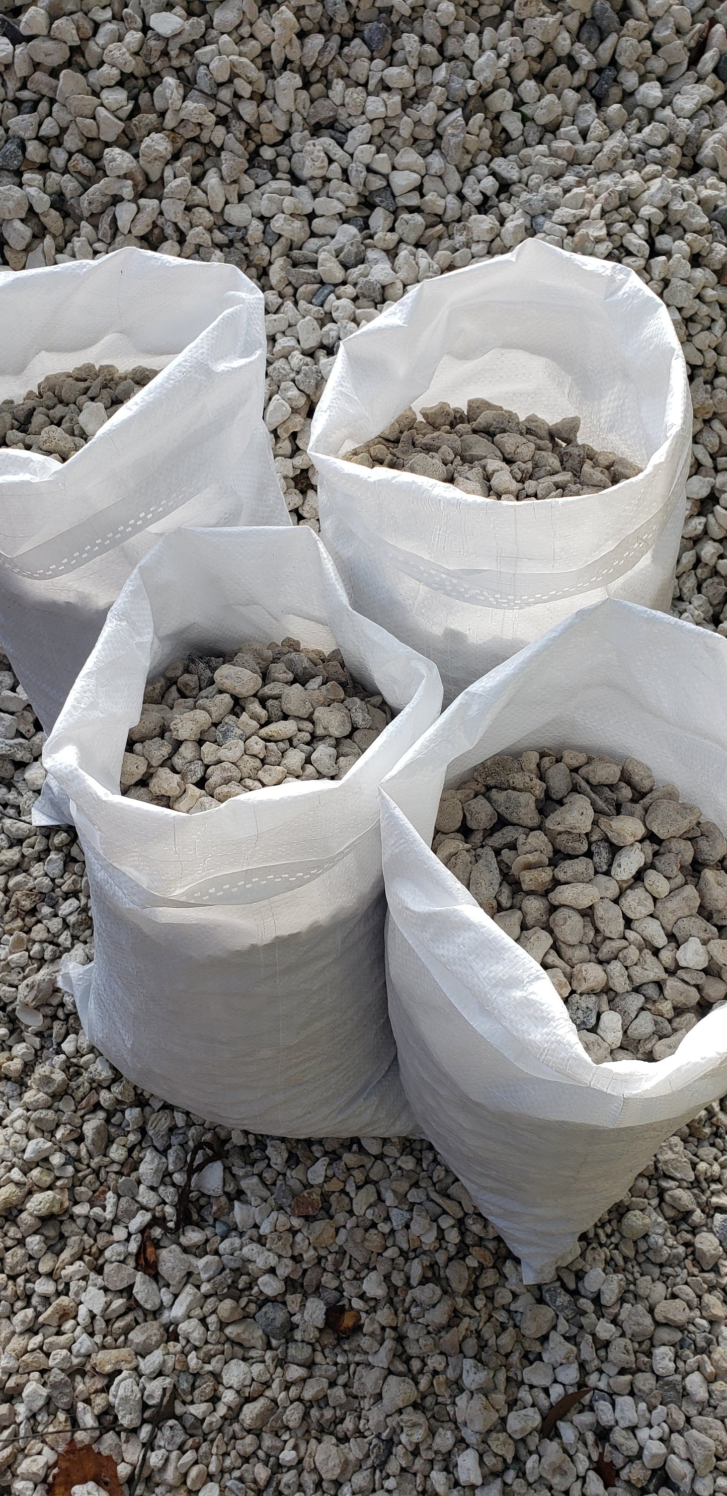 White River Rock 1" to 1.5" in convenient bags for landscaping, decorative rock projects, garden beds, and pathways from Mulch and Stuff