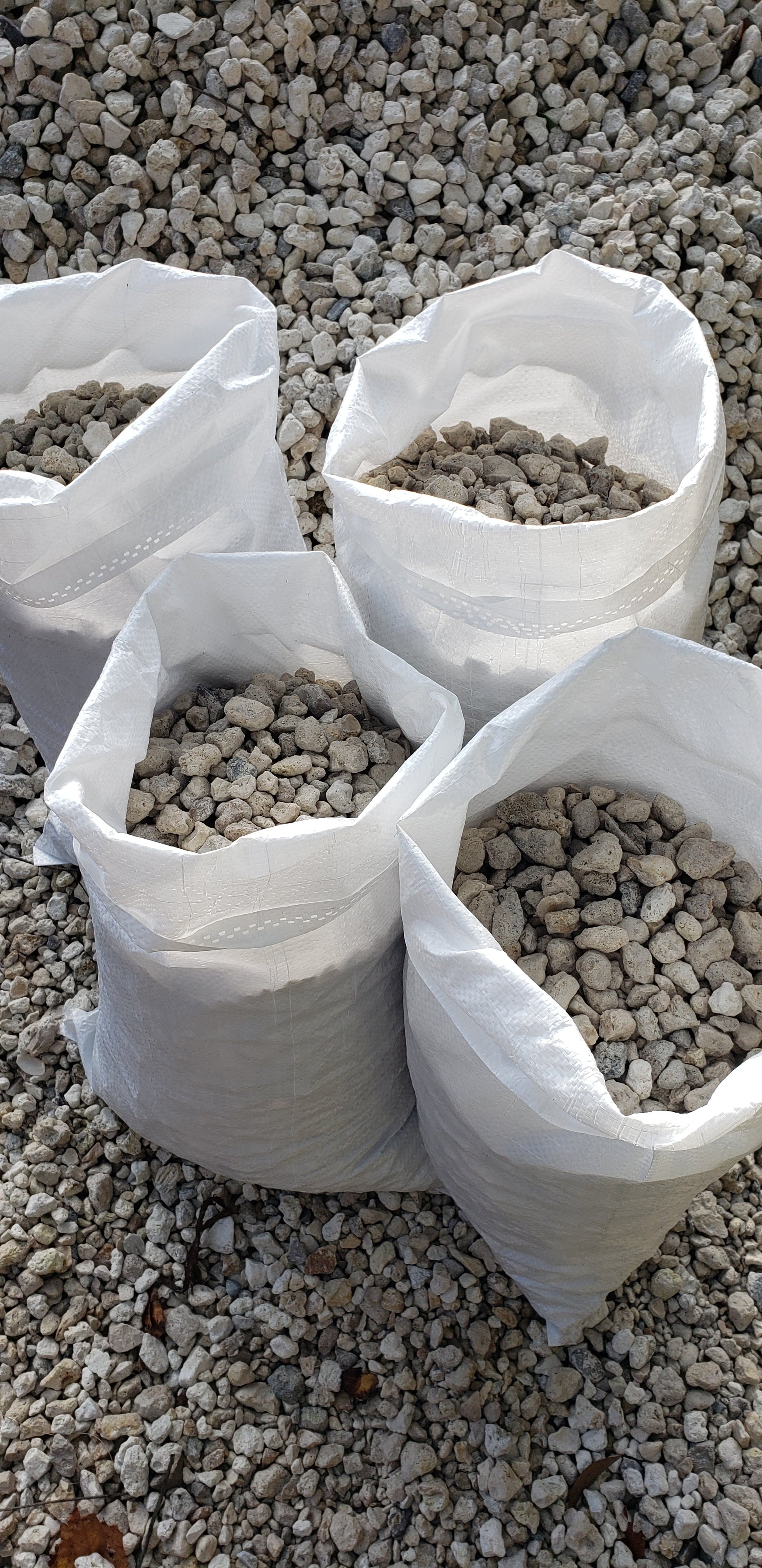 White River Rock 1" to 1.5" in convenient bags for landscaping, decorative rock projects, garden beds, and pathways from Mulch and Stuff