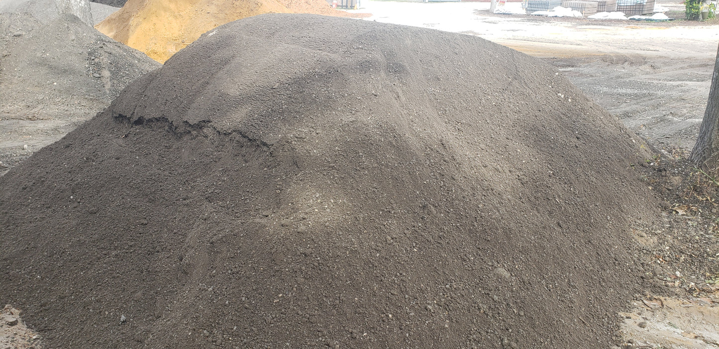 Bulk pile of Paver Base Type 2 Grade B showing finely ground asphalt blend with crushed stone and fines for paver foundations, patios, walkways, and driveways.
