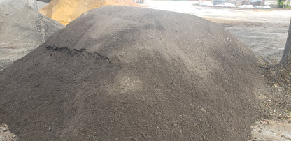 Bulk pile of Paver Base Type 2 Grade B showing finely ground asphalt blend with crushed stone and fines for paver foundations, patios, walkways, and driveways.