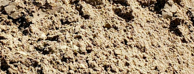Close-up view of clean fill dirt showing texture and composition for landscaping and construction projects